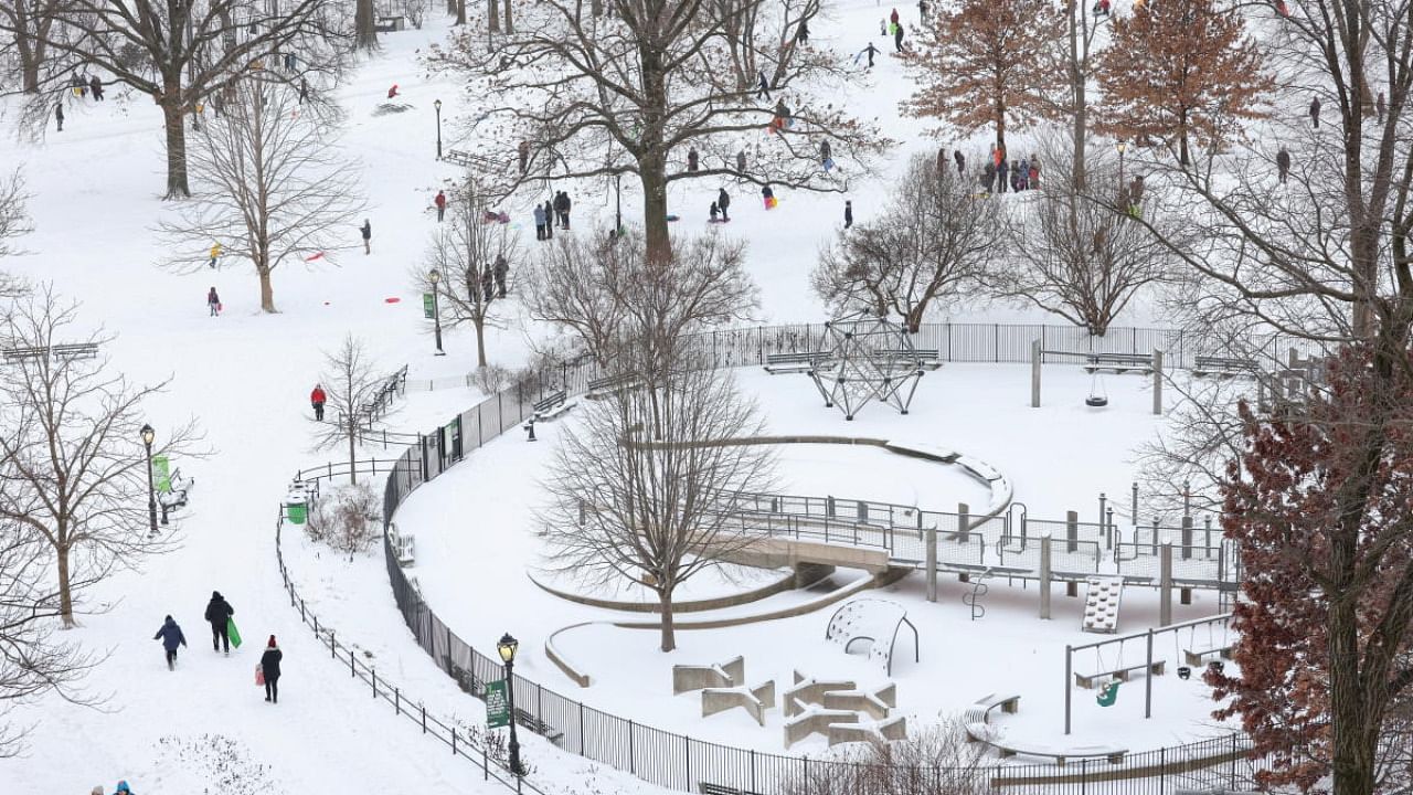 People enjoy snow at Central Park as a powerful Nor'easter storm hits the region, in New York City. Credit: Reuters photo