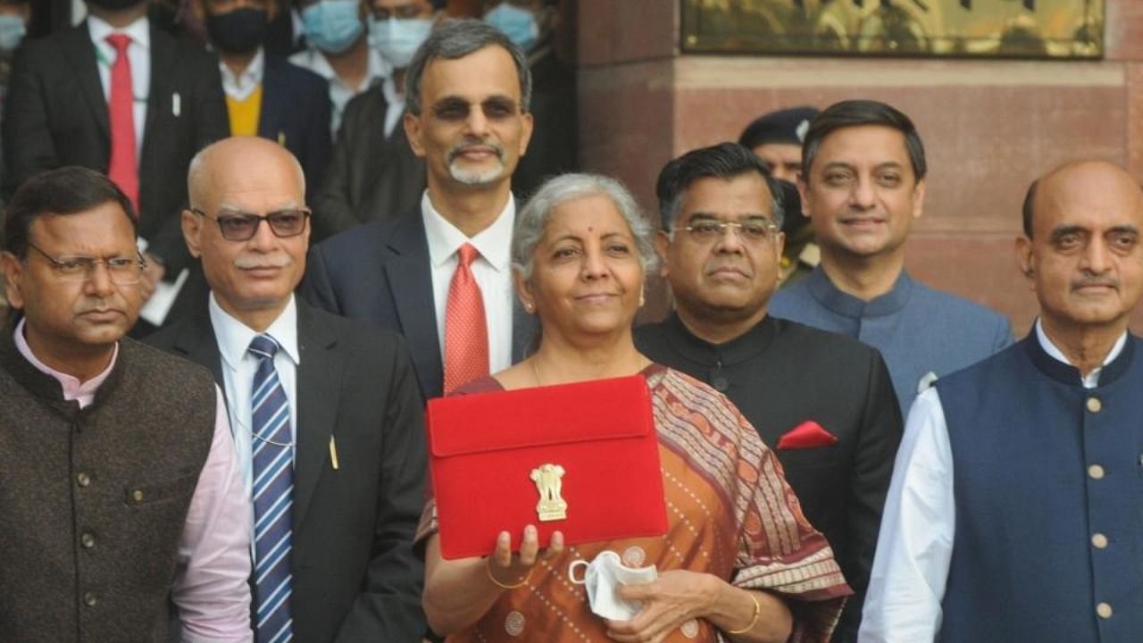 Union Finance Minister Nirmala Sitharaman with MoS Finance Pankaj Chaudhary and Dr Bhagwat Kishanrao Karad and other officials leaving from the Ministry of Finance to present and read out the Budget 2022 at Parliament, in New Delhi on Tuesday, February 01, 2022. Credit: IANS Photo