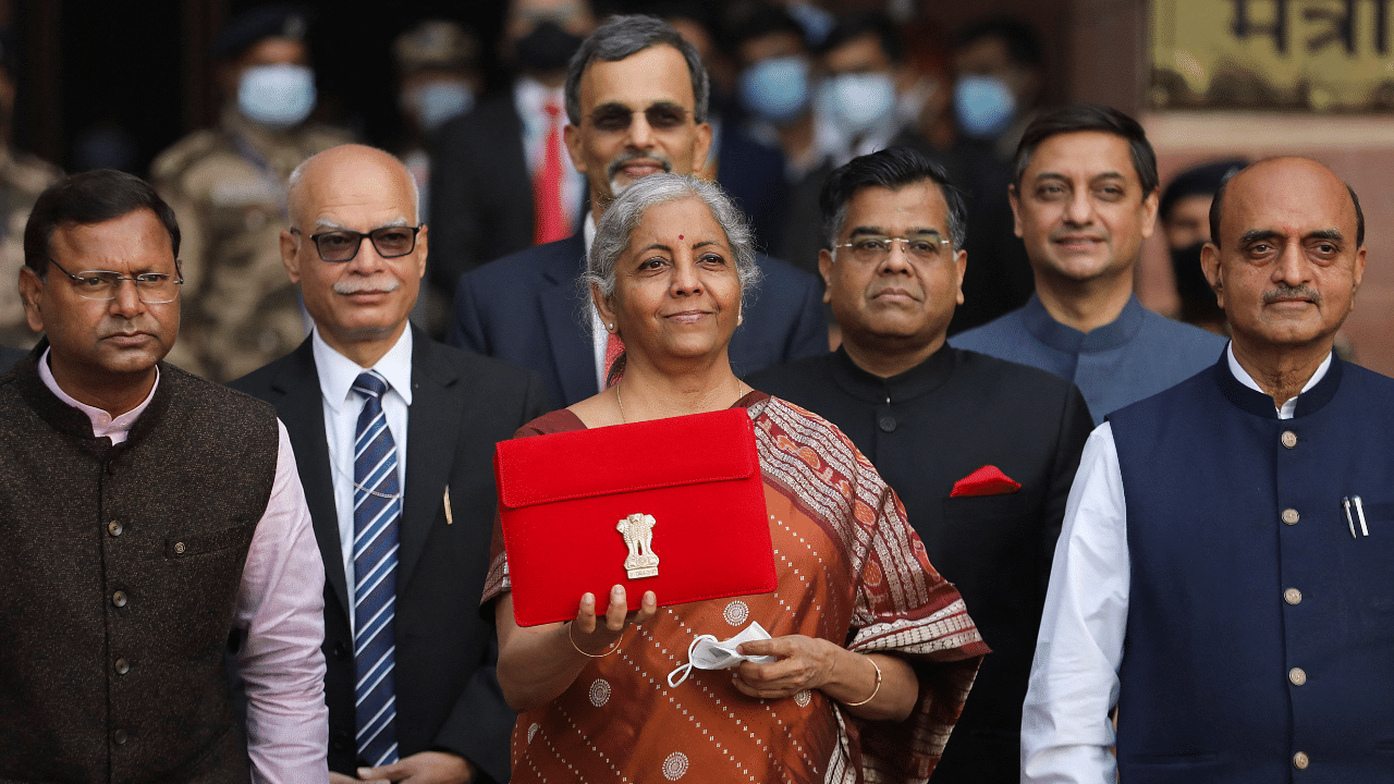 Finance Minister Nirmala Sitharaman holds up a folder with the Government of India’s logo as she leaves her office to present the federal budget in the parliament in New Delhi. Credit: Reuters Photo