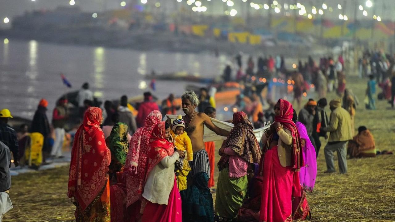 Hindu devotees arrive to take a holy dip at the Sangam, the confluence of the rivers Ganges and Yamuna and mythical Saraswati, on the eve of the auspicious bathing day of 'Mauni Amavasya' during the annual Magh Mela festival. Credit: AFP Photo