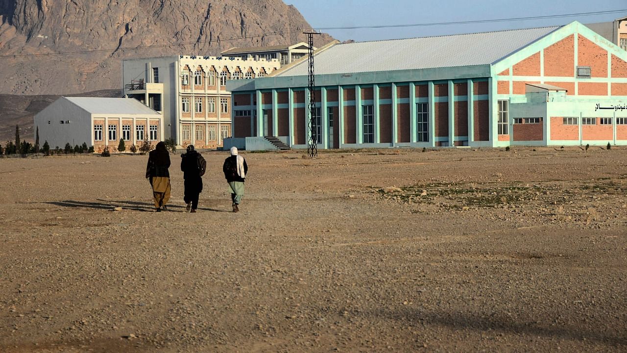 Students walk in the courtyard of Kandahar University. Credit: AFP Photo
