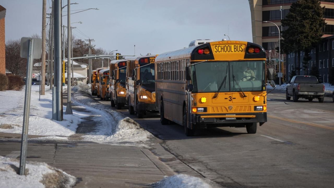 School buses wait to evacuate students and staff of the South Education Center school after a shooting took place in Richfield, Minnesota. Credit: Reuters photo
