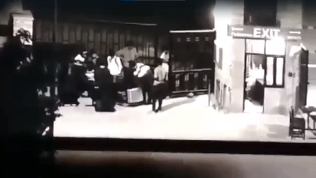 A screengrab of the CCTV footage showing the girl step out of the suitcase at a college hostel in Manipal. Credit: Twitter
