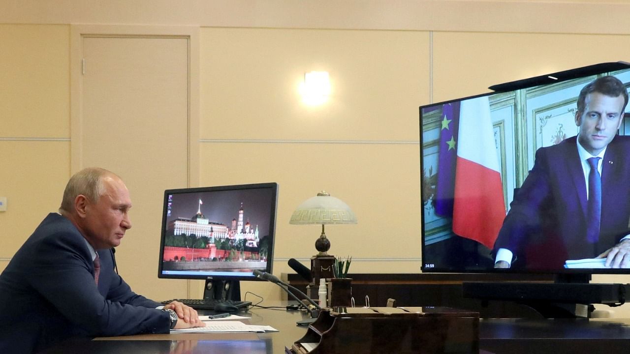 Russia's President Putin speaks with his French counterpart Emmanuel Macron. Credit: Reuters File Photo