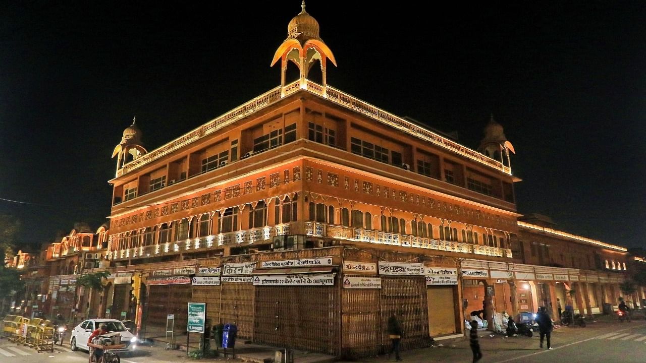 Closed shops at a market due to the night curfew imposed by the Rajasthan government to curb the spread of Covid-19, at walled city in Jaipur, Tuesday. Credit: PTI File Photo