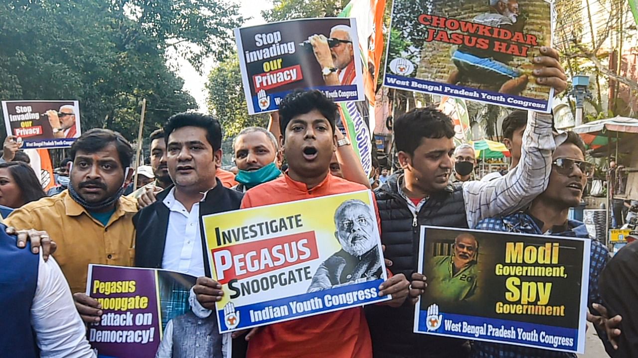 : Indian Youth Congress (IYC) members stage a protest on Pegasus issue, outside West Bengal Governor's residence in Kolkata. Credit: PTI Photo