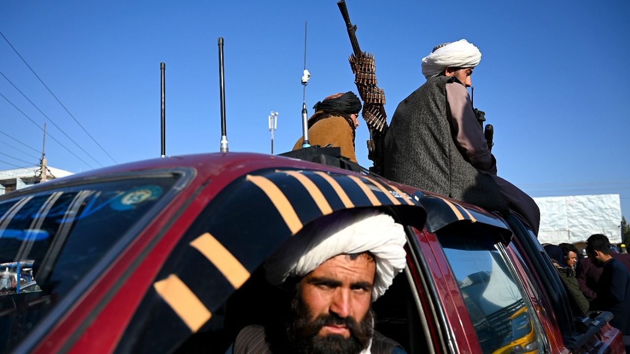 Taliban fighters sit on a vehicle along a road in the Herat on February 3, 2022. Credit: AFP File Photo