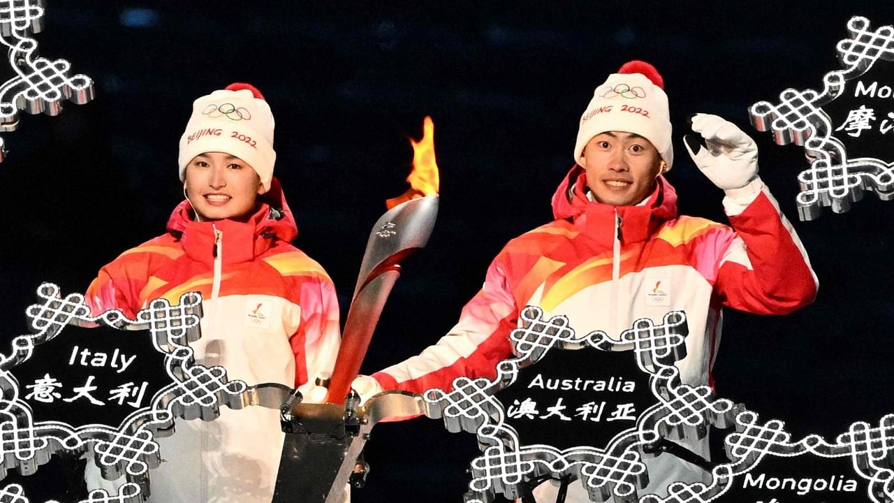The selection of Yilamujiang (L) as one of the final two torchbearers came as many western nations diplomatically boycotted the Winter Games over China's treatment of Uyghurs. Credit: AFP Photo