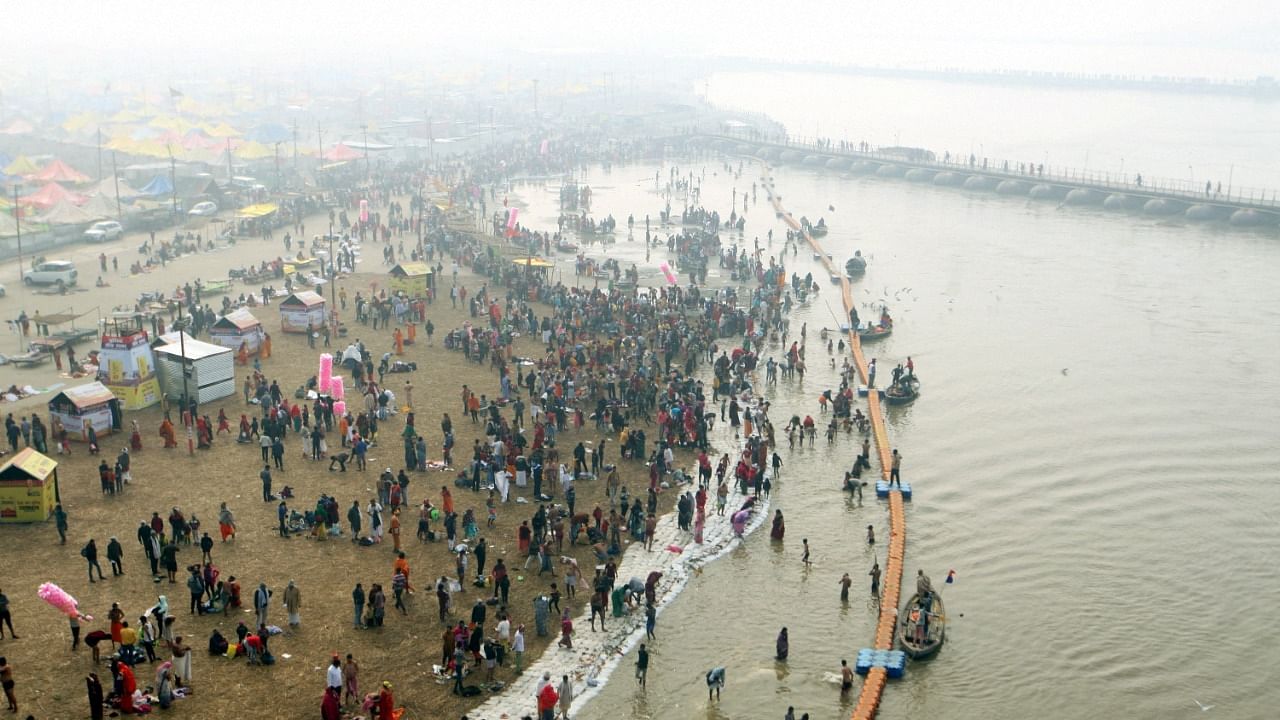 Devotees take holy dip at Sangam, the confluence of the Ganges, Yamuna and Saraswati rivers, on the occasion of Vasant Panchami. Credit: PTI Photo