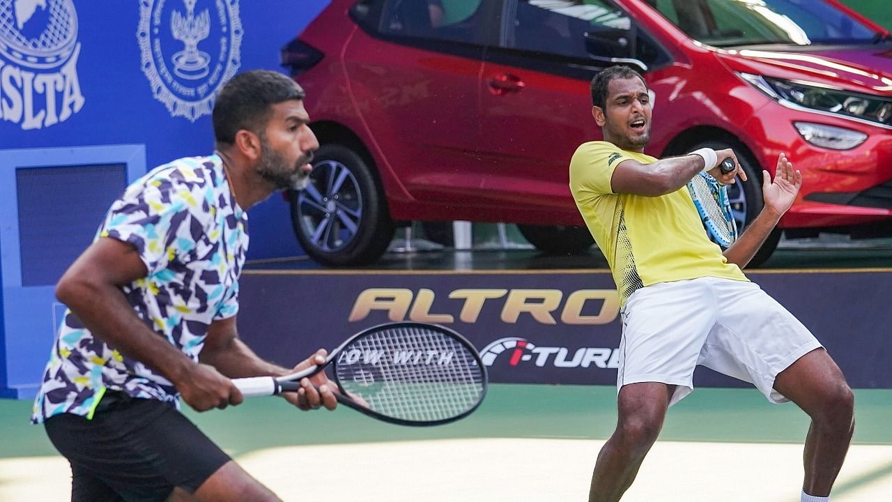 Indian duo Rohan Bopanna and Ramkumar Ramanathan in action against Australia's Luke Saville and John-Patrick Smith. Credit: PTI Photo