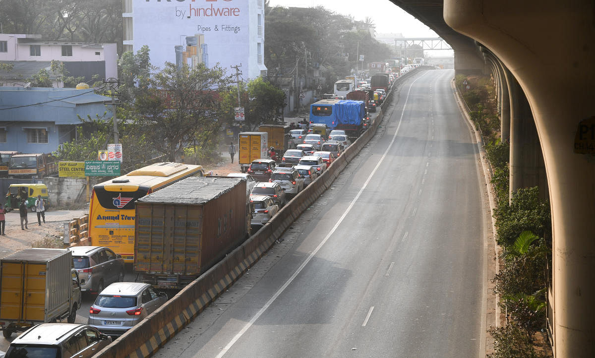 The main highway below the Peenya flyover was closed to traffic on Sunday. The NHAI is still repairing the flyover, which has stayed shut since December 25. DH PHOTO/B H SHIVAKUMAR