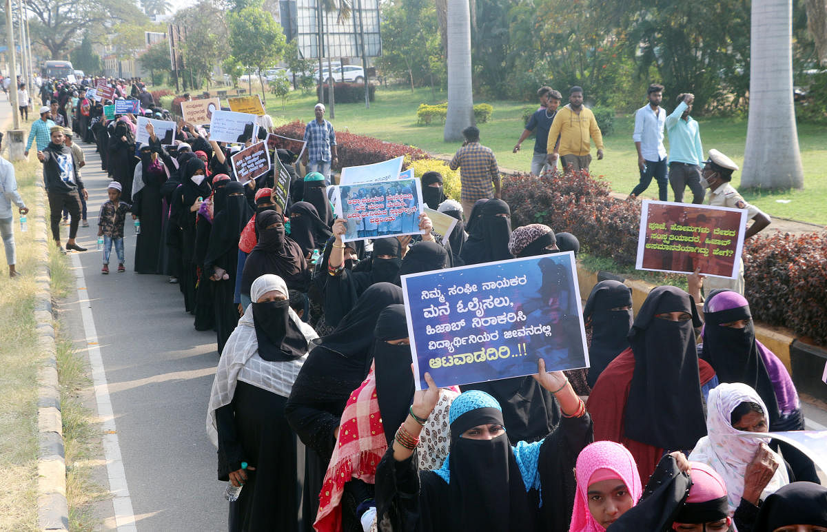 Muslim students take out a march demanding that they be allowed to wear hijab in colleges, in Chamarajanagar on Monday. DH Photo