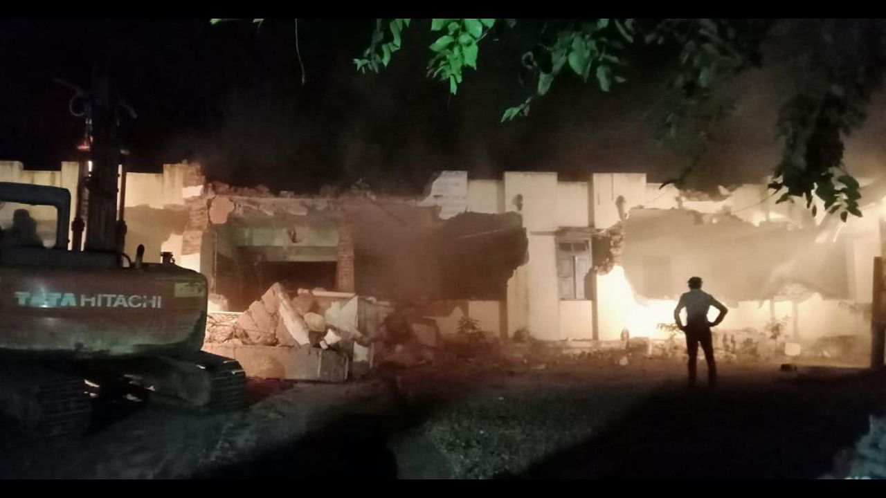 The demolition of Maharani's New Type Model (NTM) Primary School underway on Narayana Shastri (NS) Road, in Mysuru, on Monday night. Credit: DH Photo