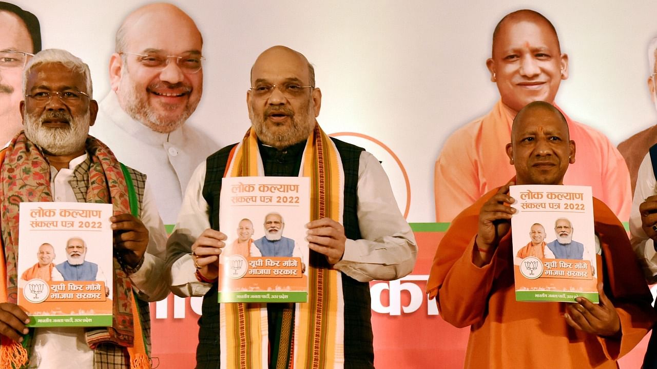 The 'sankalp patra' was released by Union Home Minister Amit Shah in the presence of other senior leaders, including UP CM Yogi Adityanath. Credit: PTI Photo