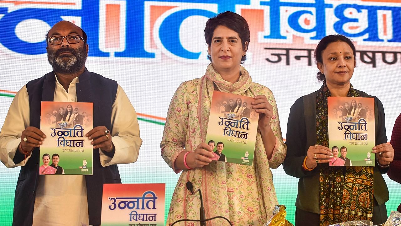 AICC General Secretary Priyanka Gandhi Vadra with others, releases party manifesto 'Unnati Vidhan Jan Ghoshna Patra' for the Uttar Pradesh Assembly elections. Credit: PTI Photo