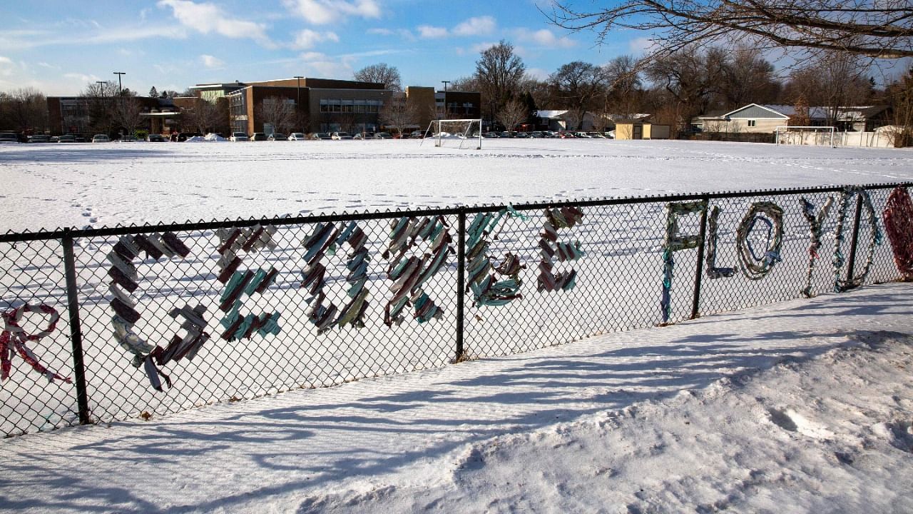 "George Floyd" is displayed on a fence in front of South Education Center Academy in Richfield, Minnesota, on February 1, 2022. Credit: AFP File Photo