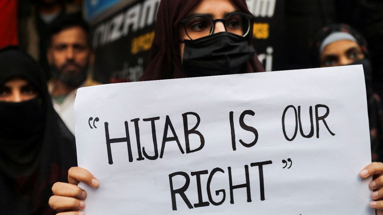 <div class="paragraphs"><p>A Muslim woman holds a placard. Image for representation.&nbsp;</p></div>