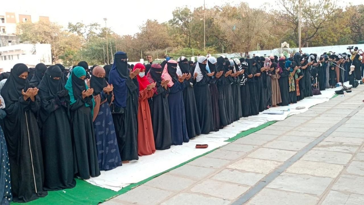 Muslim women participate in a silent protest against banning Muslim girls wearing hijab from attending classes at some schools in Karnataka, in Hyderabad. Credit: IANS Photo