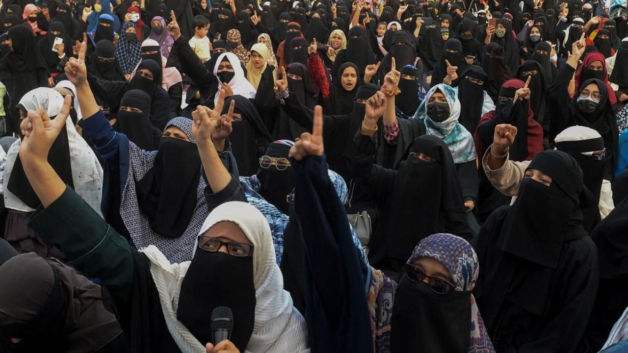 Muslim women take part in a demonstration in Hyderabad to protest after students at government-run high schools in India's Karnataka state were told not to wear hijabs in the premises of the institute. Credit: AFP Photo