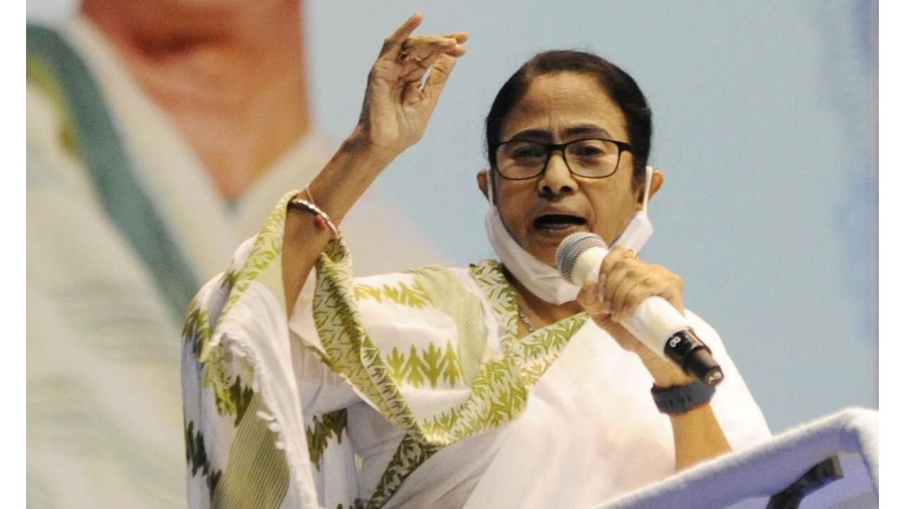  West Bengal Chief Minister Mamata Banerjee addresses after handing over freehold title deeds to residents of refugee colonies at Netaji indoor stadium in Kolkata on Thursday. Credit: IANS Photo