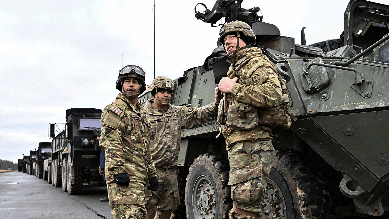 Soldiers of the U.S. 2nd Cavalry Regiment prepare their gear for deployment to Romania, in Vilseck. Credit: Reuters Photo