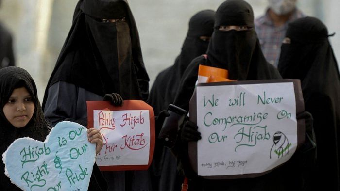 Burqa clad Muslim women take part in a demonstration in Hyderabad on February 9, 2022 to protest after students at government-run high schools in India's Karnataka state were told not to wear hijabs in the premises of the institute. Credit: AFP Photo