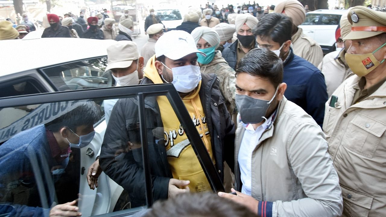 Bhupinder Singh alias Honey, the arrested nephew of Punjab Chief Minister Charanjit Singh Channi, being taken by Enforcement Directorate (ED) officials to a court in connection with a money laundering investigation into alleged sand mining operations in Punjab, in Jalandhar, Tuesday. Credit: PTI File Photo