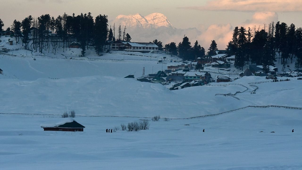 Snow covered huts are pictured in Gulmarg. Credit: AFP Photo