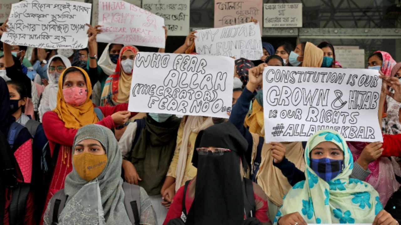 Muslim students display placards during a protest against the recent hijab ban in few colleges of Karnataka state. Credit: Reuters Photo 