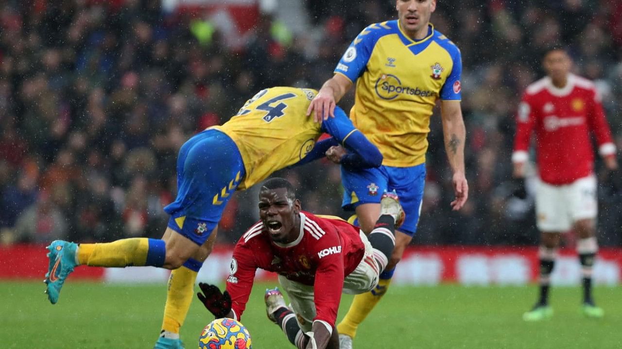 Manchester United's Paul Pogba in action with Southampton's Oriol Romeu and Mohamed Elyounoussi. Credit: Reuters Photo