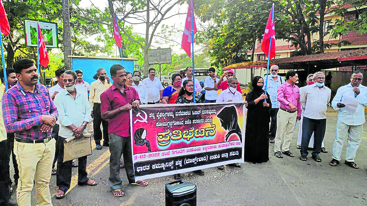 CPM leaders stage a protest in Udupi.