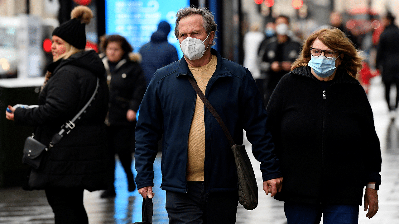 Shoppers wear protective face masks as they walk on Oxford Street, as rules on wearing face coverings in some settings in England are relaxed, amid the spread of the coronavirus disease pandemic, in London, Britain. Credit: Reuters Photo
