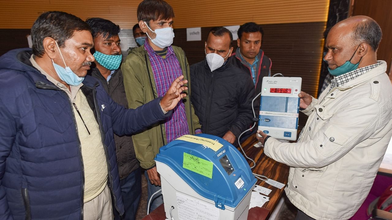 Polling officials take part in Electronic Voting Machine and Voter Verifiable Paper Audit Trail (VVPAT) training for upcoming state Assembly polls at a training centre, in Prayagraj, Saturday, February 12, 2022. Credit: PTI Photo