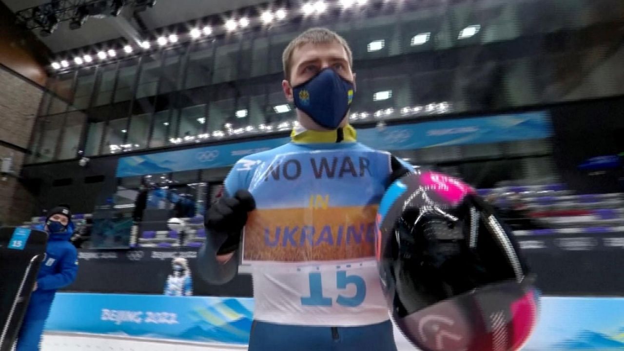 Vladyslav Heraskevych of Ukraine holds a sign with a message reading 'No war in Ukraine'. Credit: Reuters Photo