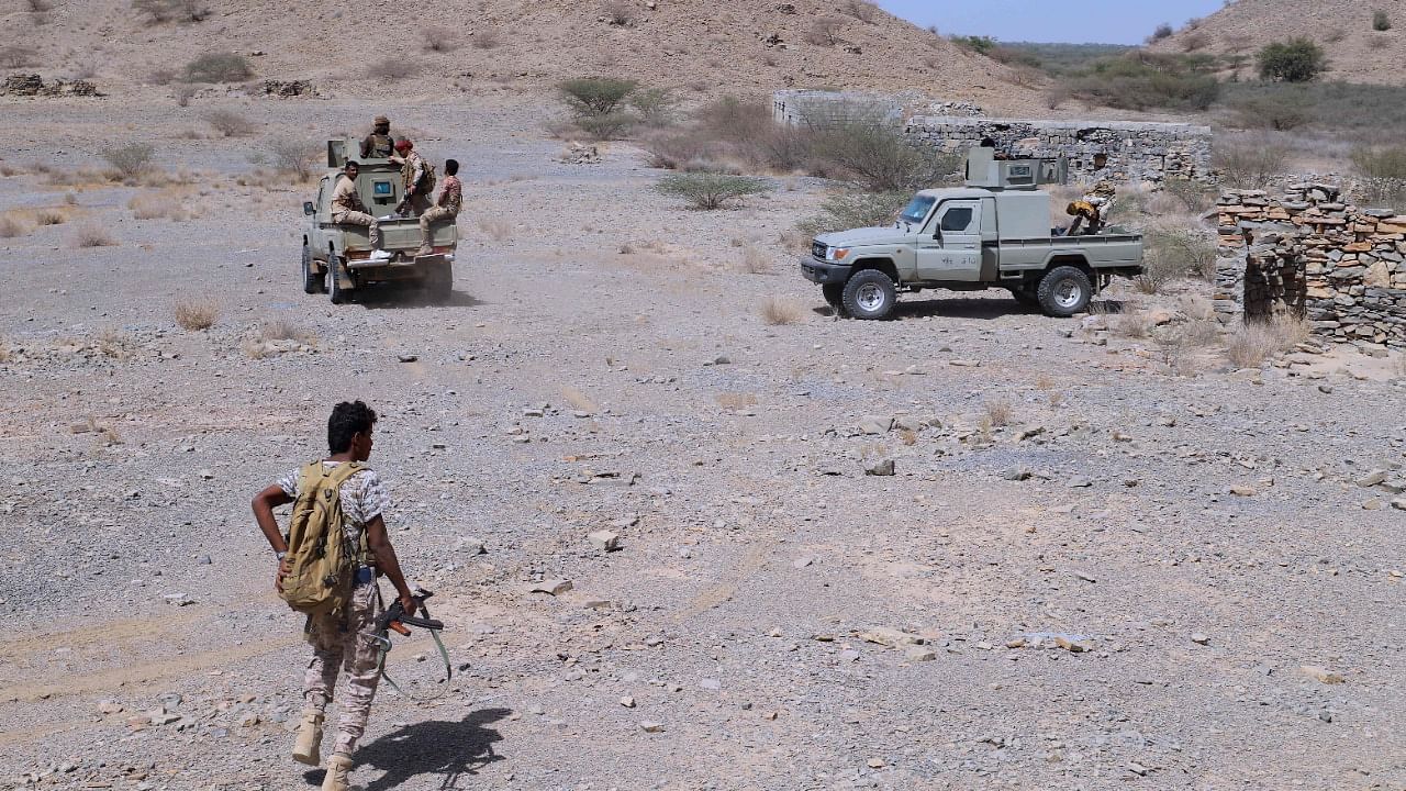 Yemeni pro-government fighters man a position near al-Muhsam camp to drive the pro-Iran Huthi rebels from Harad in Yemen's Hajjah province. Credit: AFP Photo