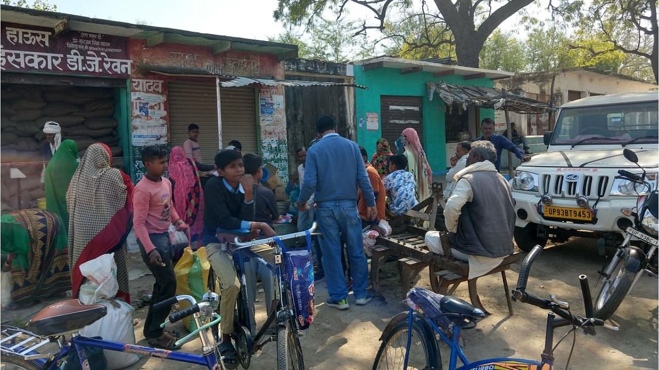 Residents lineup for free food grains in Rewan, Bundelkhand. Credit: DH Photo