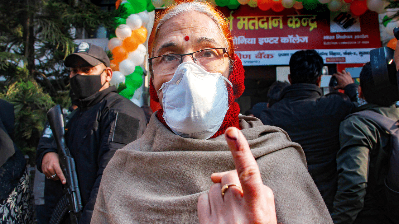  woman shows her finger marked with indelible ink after casting vote, during the second phase of Uttar Pradesh Assembly elections. Credit: PTI Photo