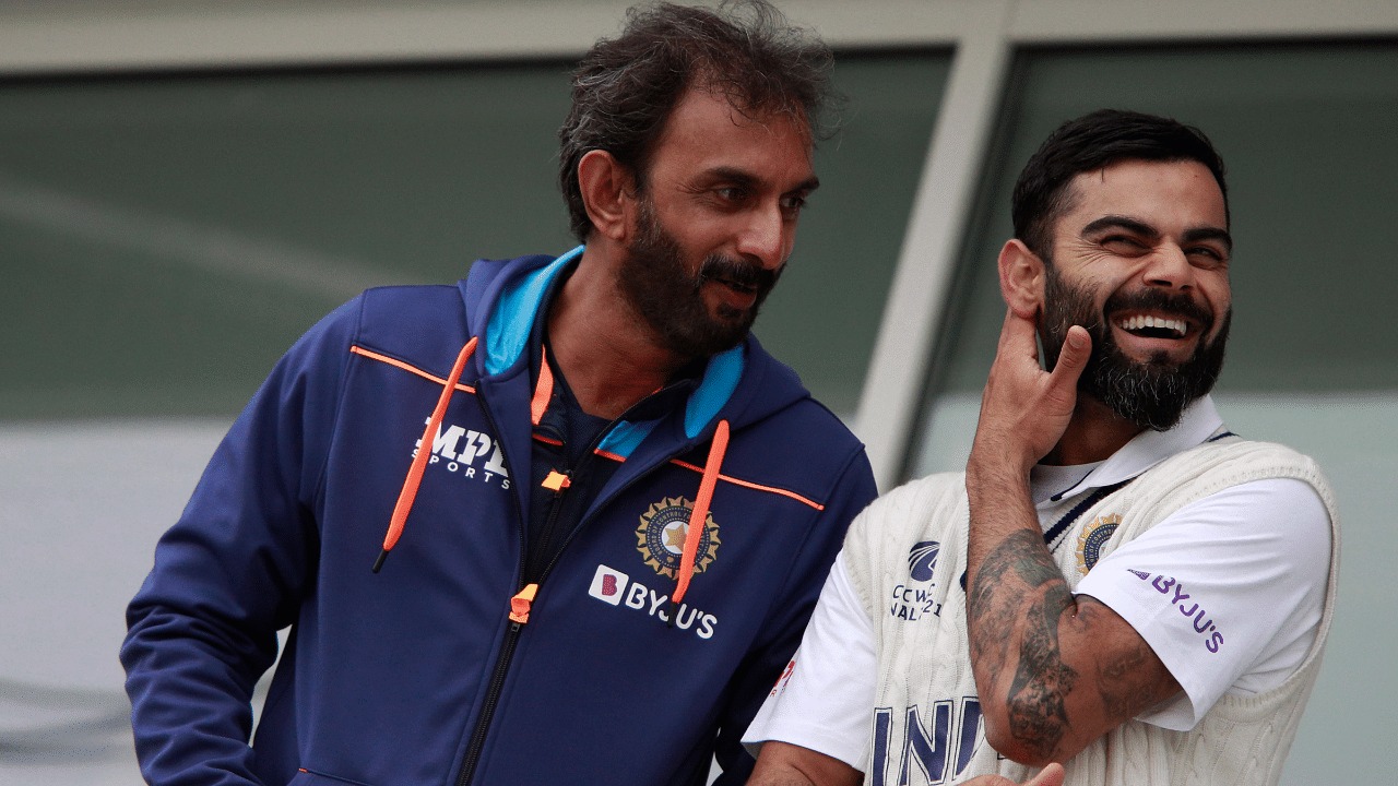 India's captain Virat Kohli, right, shares a light moment with batting coach Vikram Rathour. Credit: AP Photo