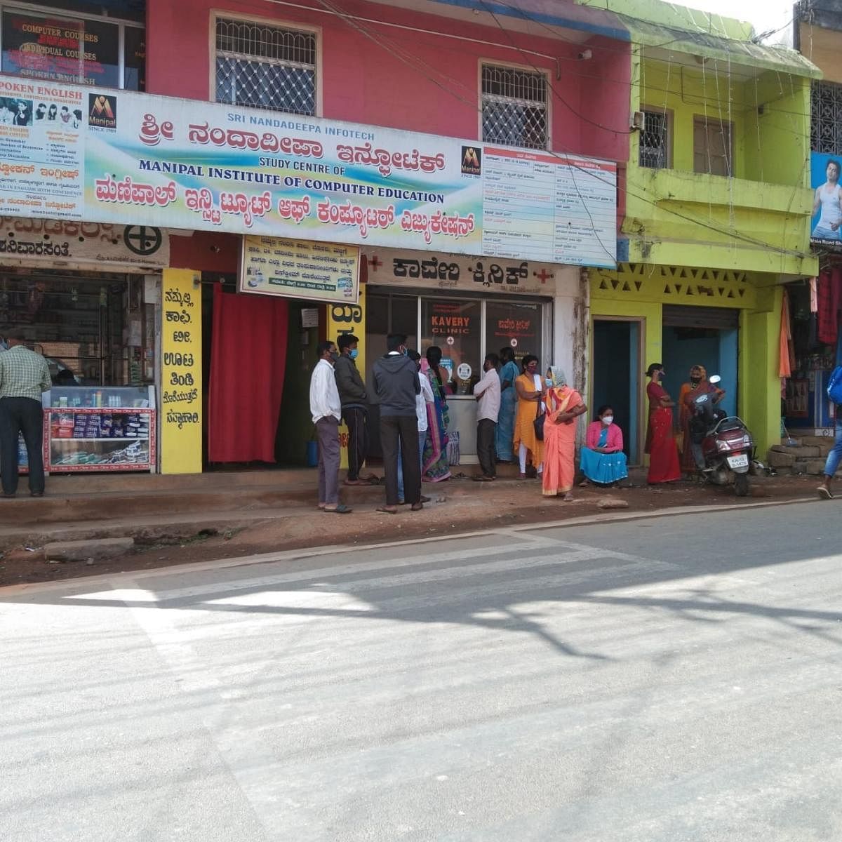 Patients wait outside a clinic at Shanivarasanthe for treatment. DH file photo