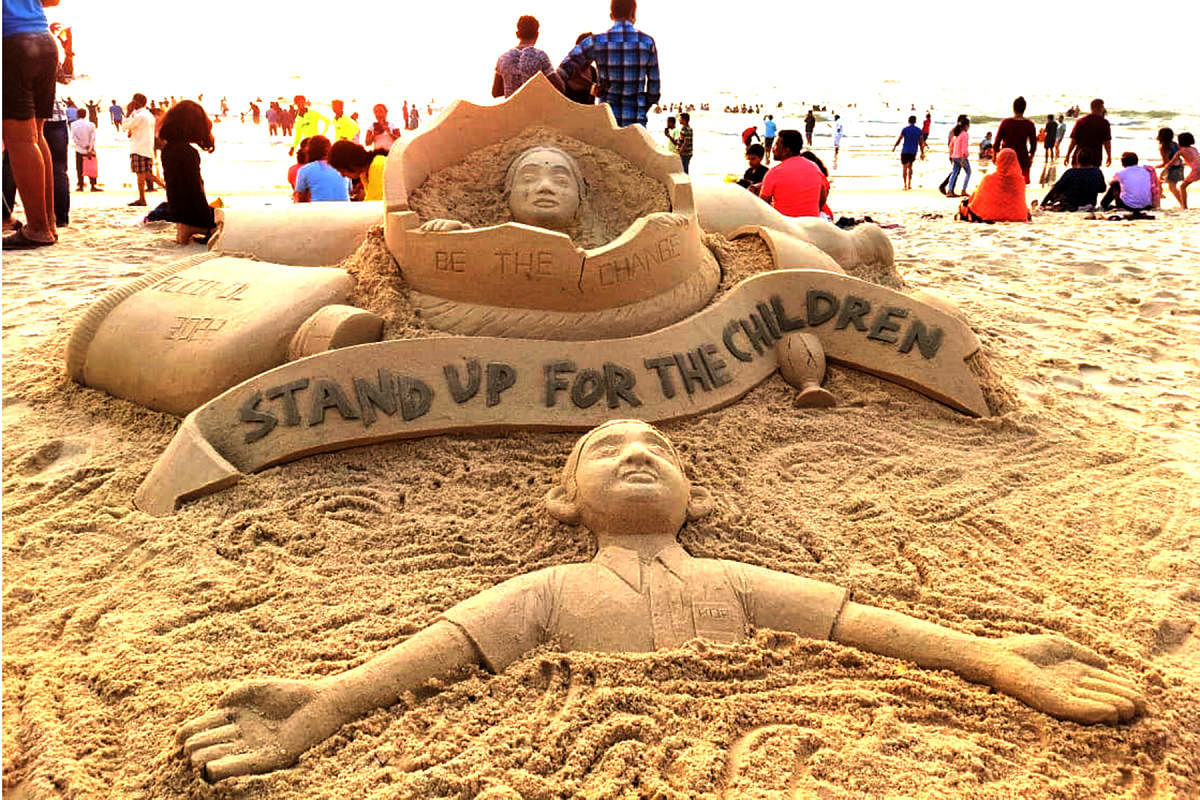 Artist Harish Saga and team sculpted a sand sculpture titled ‘Stand up for the Children’ to create awareness on addiction among children on the shores of Malpe Beach. 