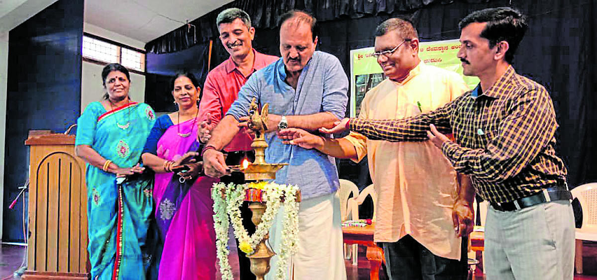 Ambalpadi Janardhana and Mahakali Temple trustee Dr Vijay Ballal inaugurates a programme to release ‘Athmakathanagalalli Shala Shikshana’ in Udupi.