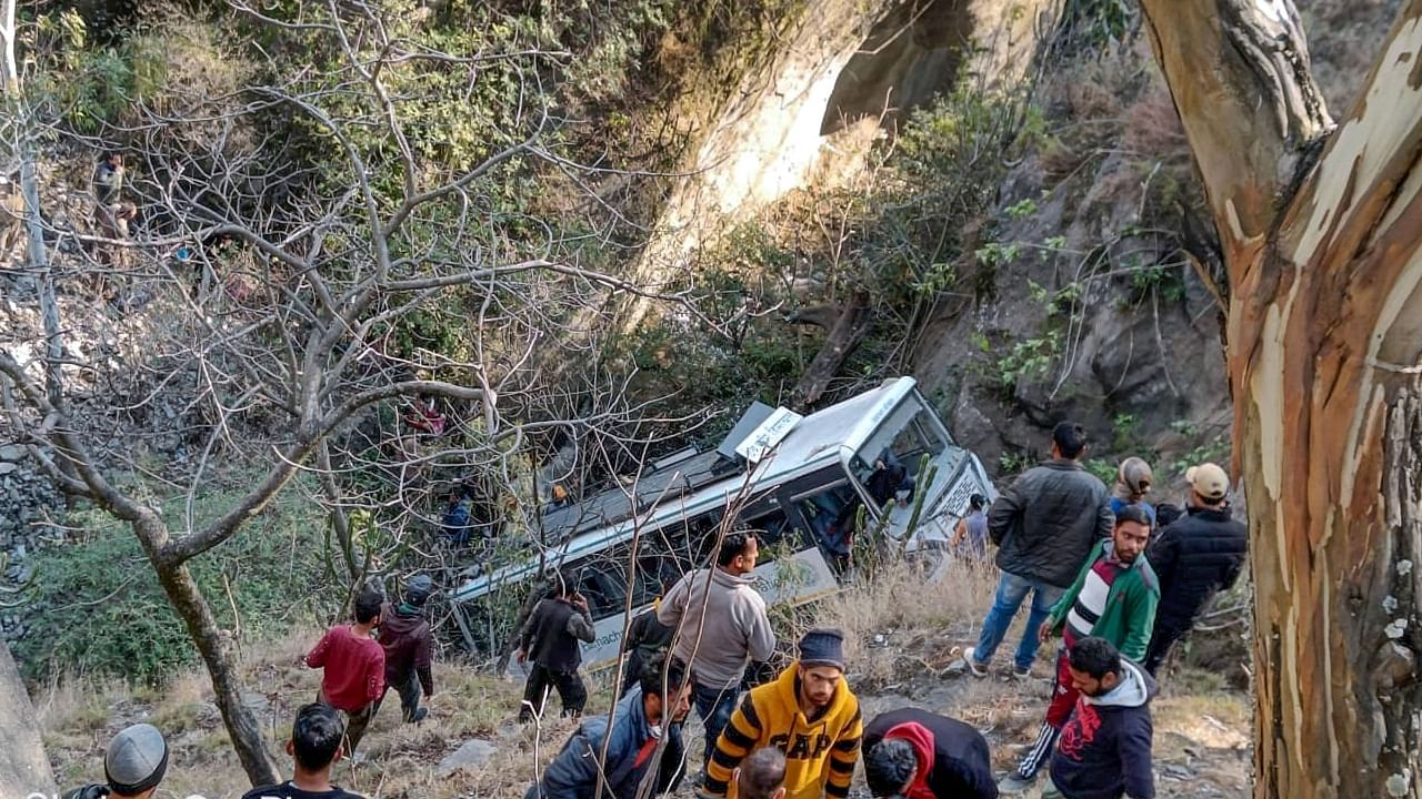 A Himachal Road Transport Corporation (HRTC) bus after it rolled down into a gorge at Jhakri near Rampur, in Shimla district. Credit: PTI Photo