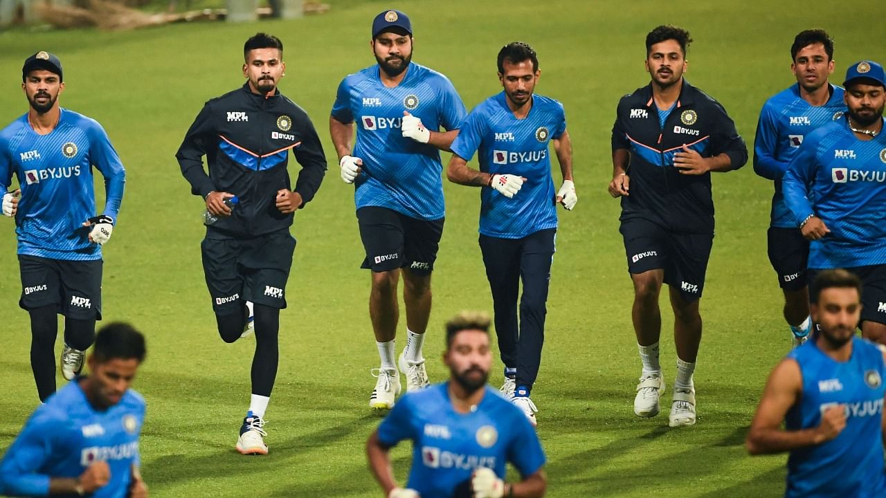 Indian captain Rohit Sharma (C) and teammates run during a training session ahead of their first T20 international match against West Indies. Credit: AFP File Photo