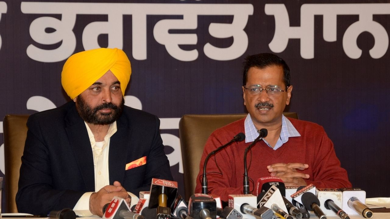 Delhi Chief Minister and AAP convener Arvind Kejriwal with Punjab AAP President and CM Candidate Bhagwant Maan, address a press conference ahead of the Punjab Assembly elections, in Amritsar. Credit: IANS File Photo