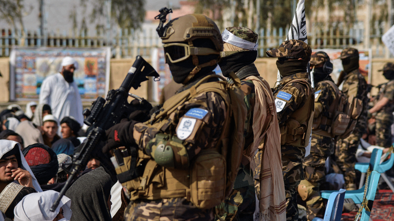 Members of the Taliban Badri 313 military unit stand guard as newly recruited Taliban members. Credit: AFP Photo