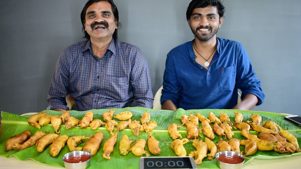 Inspired by these videos, Kumar and his father R. Porchezhiyan, 60, started a YouTube channel called "Saapattu Raman" in 2018. Credit: Special Arrangement