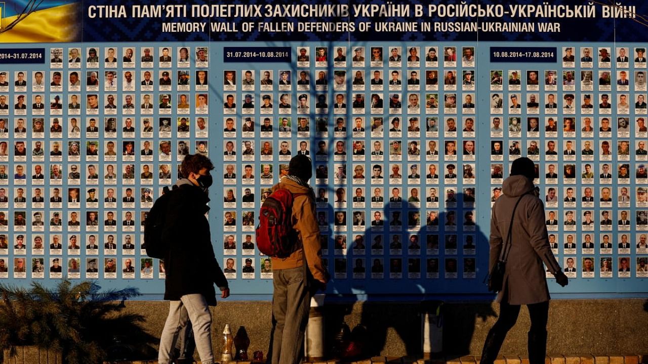 Residents walk along the Memory Wall of Fallen Defenders of Ukraine in Russian-Ukrainian War in Kyiv. Credit: Reuters photo