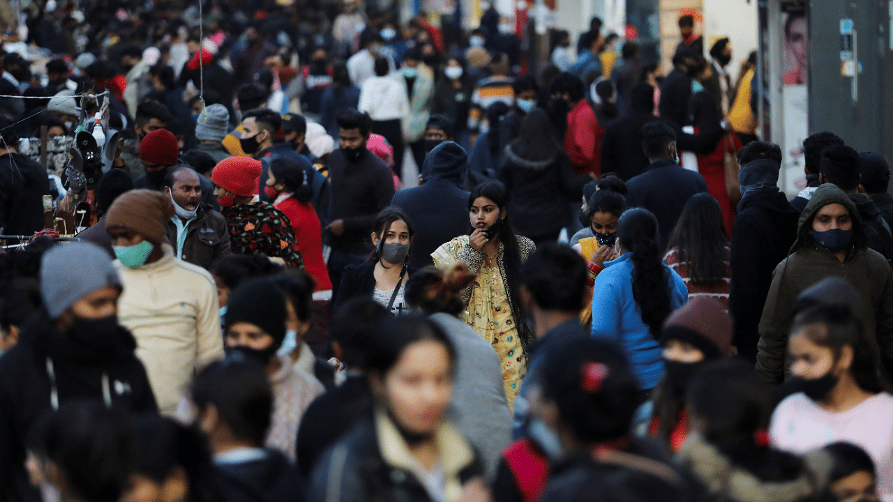 People shop at a market amidst the spread of coronavirus disease (COVID-19) in New Delhi. Credit: Reuters Photo