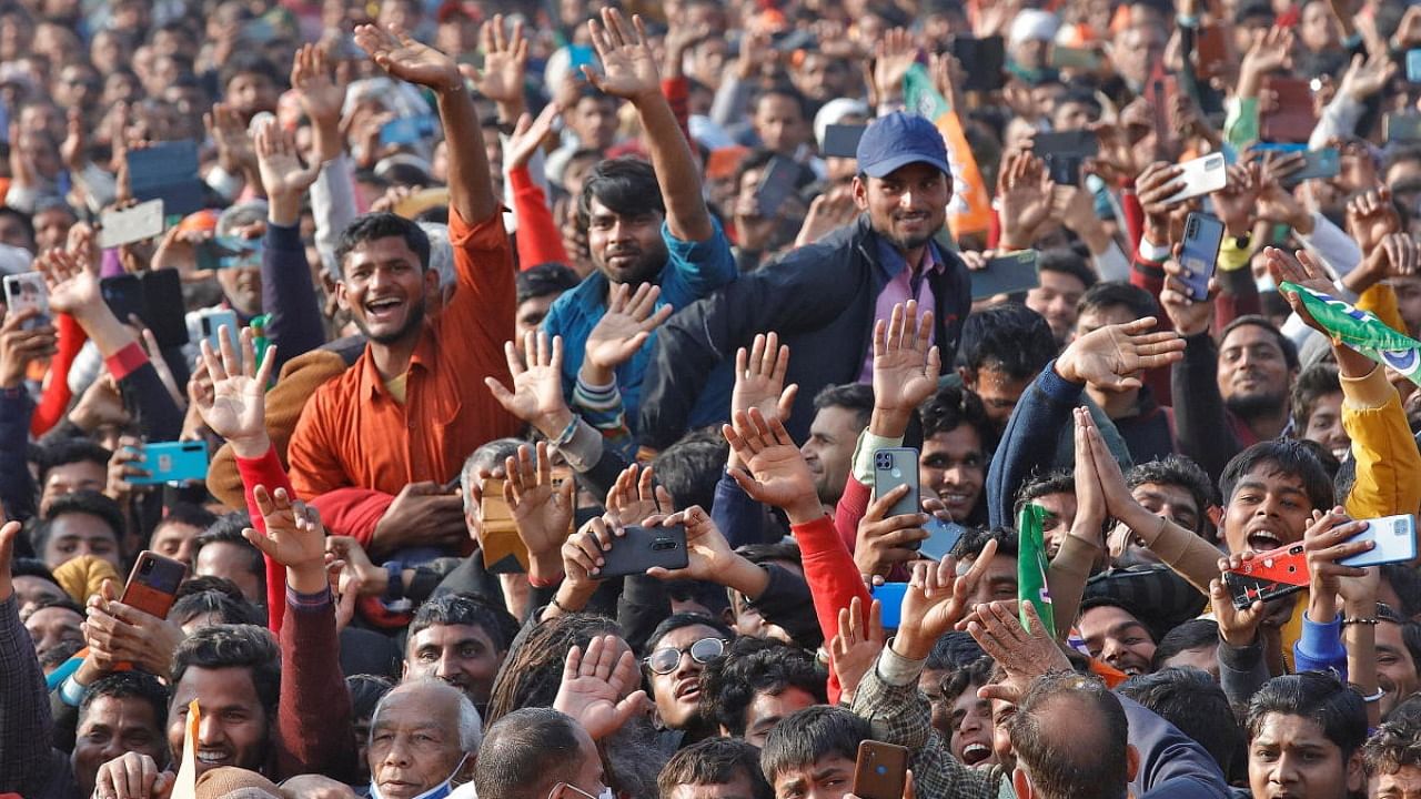 Supporters of India's ruling Bharatiya Janata Party (BJP) cheer as they listen to Yogi Adityanath, Chief Minister of the northern state of Uttar Pradesh, during an election campaign rally in Bijnor district of the northern state, India, February 10, 2022. Credit: Reuters Photo