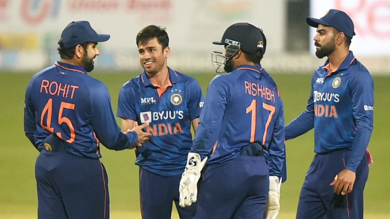 Indian bowler Ravi Bishnoi celebrates with teammates after the wicket of West Indian batsman Roston Chase, during the first T20 cricket match between India and West Indies, at Eden Gardens in Kolkata. Credit: PTI Photo